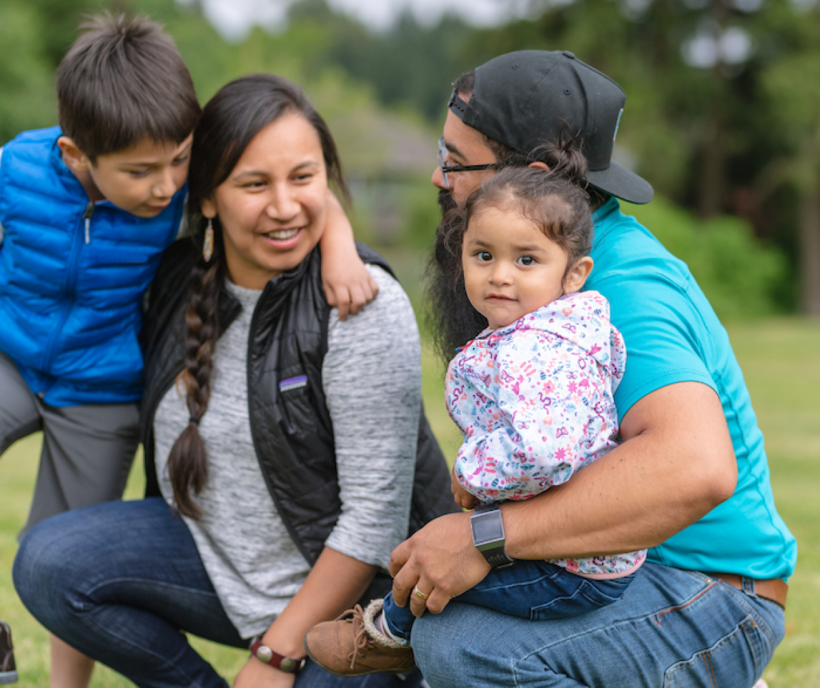 picture of indigenous family - woman, man, boy and girl